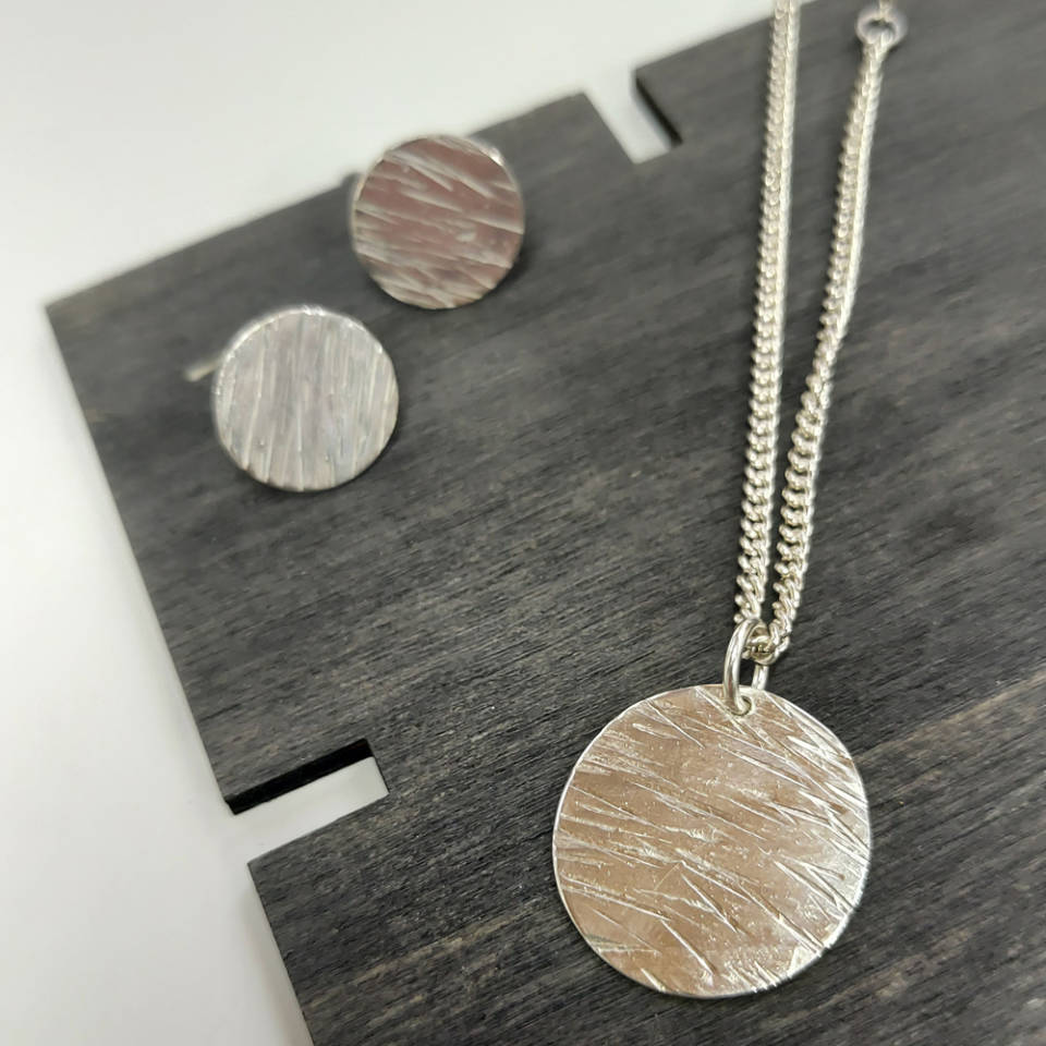 textured silver medallion pendant